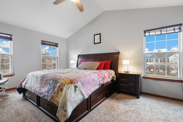 carpeted bedroom featuring ceiling fan and vaulted ceiling