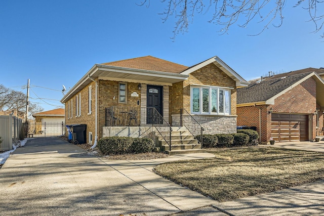 view of front facade featuring brick siding and fence