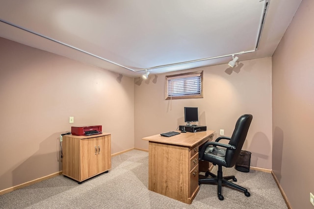 office area with rail lighting, light carpet, and baseboards