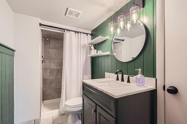 full bath with toilet, tile patterned floors, visible vents, a shower stall, and vanity