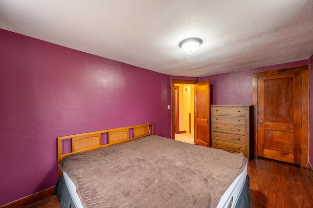 bedroom featuring dark hardwood / wood-style floors