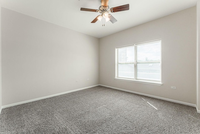 empty room with carpet flooring and ceiling fan