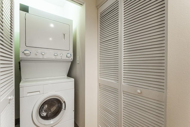 laundry room featuring stacked washer and dryer