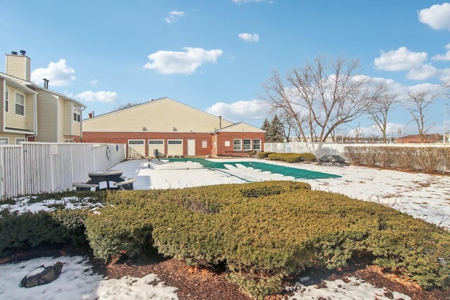 exterior space with a patio area, a fenced backyard, and a fenced in pool