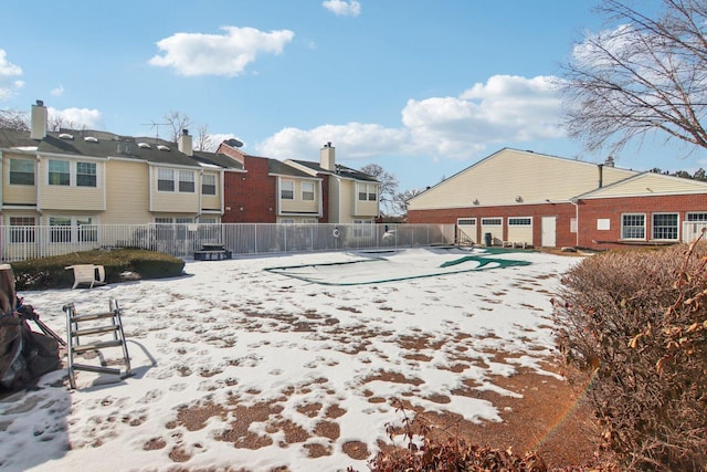 exterior space with a residential view and fence