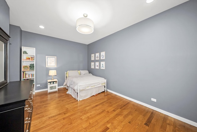 bedroom featuring recessed lighting, baseboards, and light wood finished floors