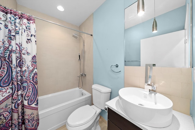 bathroom with vanity, shower / bath combination with curtain, toilet, and recessed lighting