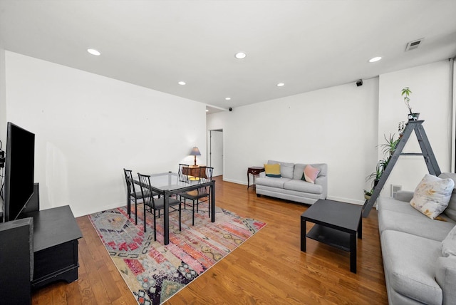 dining space featuring visible vents, recessed lighting, baseboards, and wood finished floors