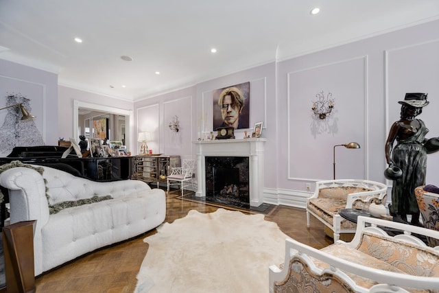 living room with a fireplace and ornamental molding