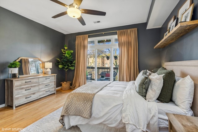 bedroom with access to outside, ceiling fan, and light hardwood / wood-style flooring