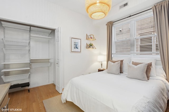 bedroom featuring a closet and light hardwood / wood-style floors