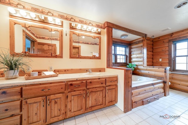 bathroom with rustic walls, visible vents, vanity, a bath, and tile patterned floors