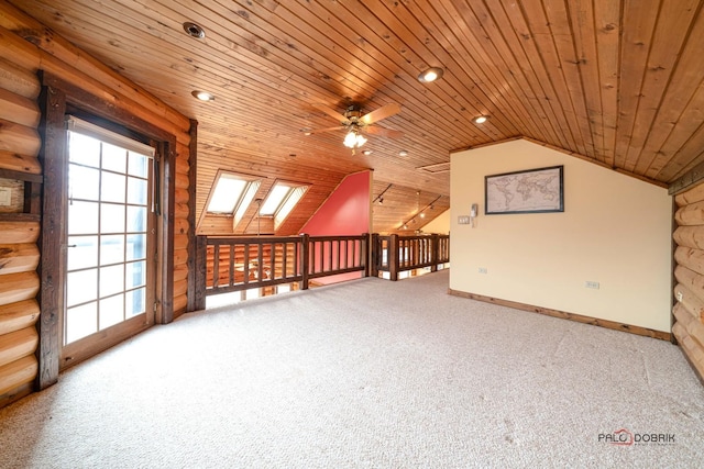 additional living space featuring lofted ceiling with skylight, wood ceiling, ceiling fan, carpet flooring, and recessed lighting