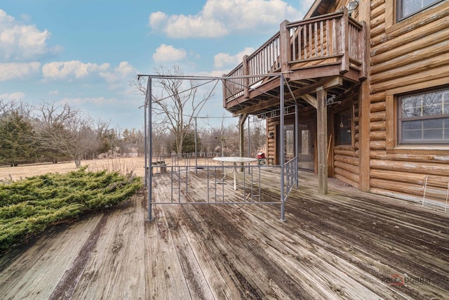 wooden deck featuring outdoor dining area