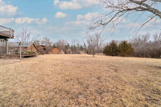 view of yard with a wooden deck