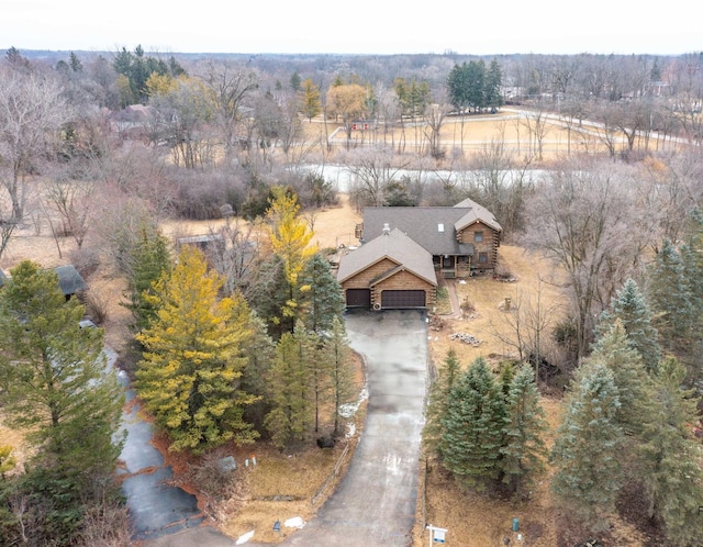 drone / aerial view with a view of trees