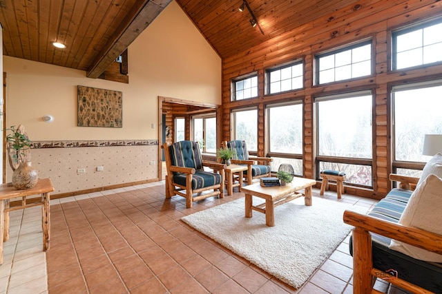 interior space with light tile patterned floors, high vaulted ceiling, rail lighting, and wood ceiling