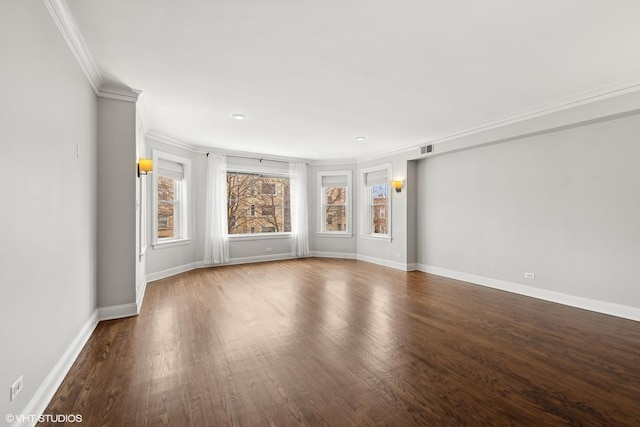 unfurnished room featuring baseboards, visible vents, dark wood-type flooring, and ornamental molding