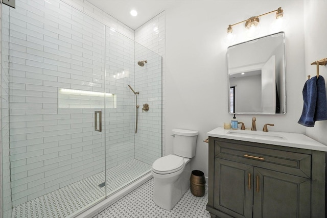 full bathroom with vanity, a stall shower, tile patterned flooring, and toilet