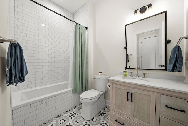 full bathroom featuring toilet, tile patterned flooring, vanity, and tiled shower / bath