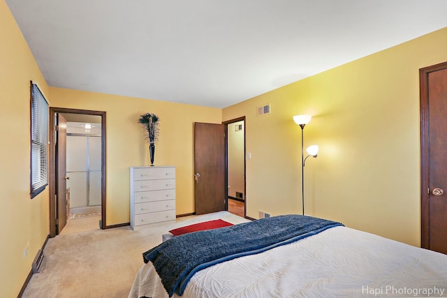 bedroom featuring light carpet