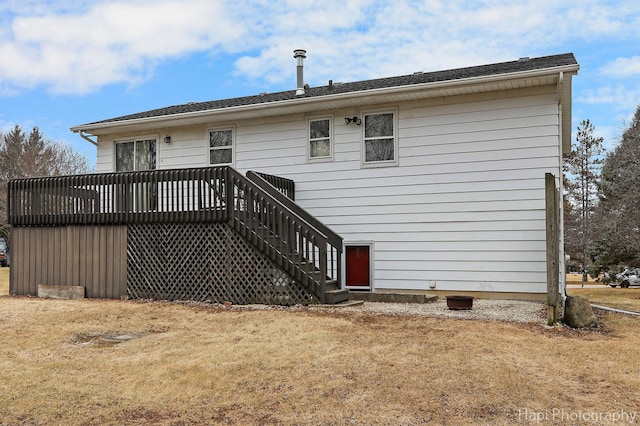 back of house with a yard and a wooden deck