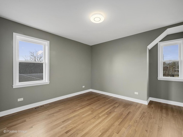 empty room with light wood-type flooring