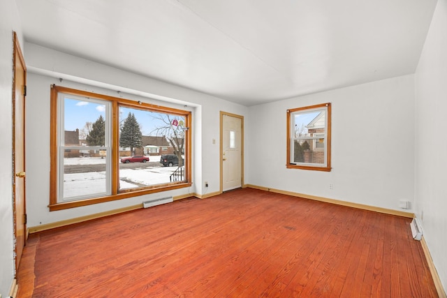 spare room with hardwood / wood-style flooring