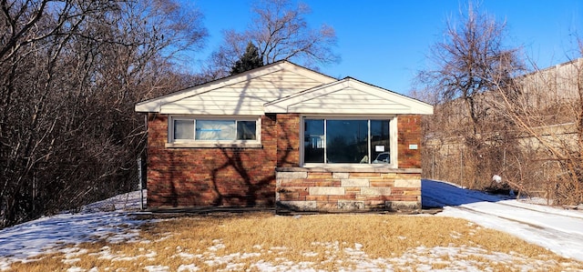 view of front of house featuring stone siding and brick siding