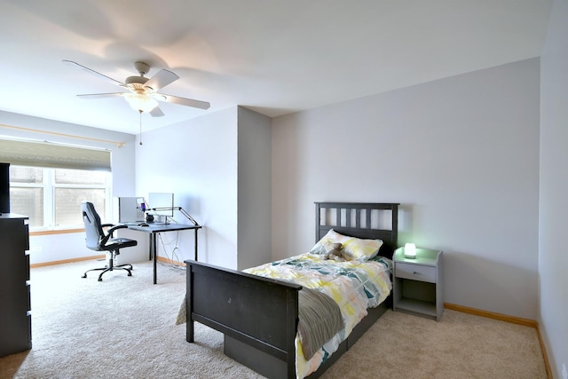 bedroom featuring light colored carpet and ceiling fan