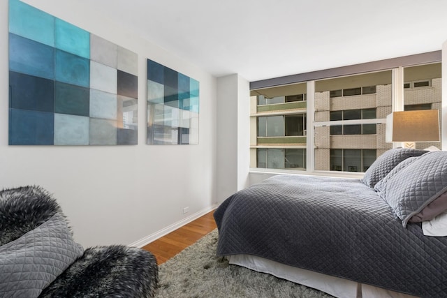 bedroom with hardwood / wood-style floors