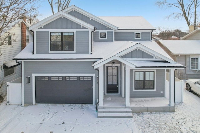 view of front of home with covered porch and a garage