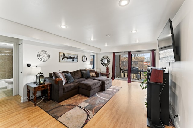 living area featuring recessed lighting and light wood finished floors