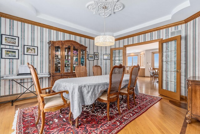10848 Crystal Ridge Ct, Orland Park, IL 60467 - dining room featuring visible vents, a raised ceiling, and an inviting chandelier