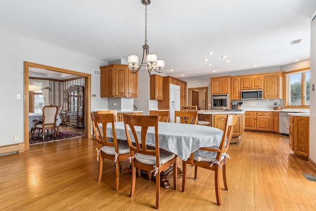 10848 Crystal Ridge Ct, Orland Park, IL 60467 - dining area with a chandelier, recessed lighting, visible vents, and light wood-type flooring