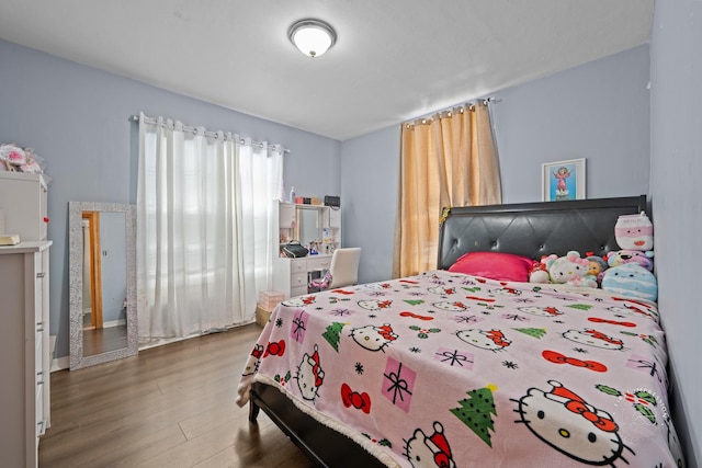 bedroom featuring wood-type flooring