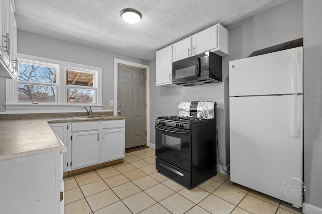 kitchen featuring white cabinets, light tile patterned floors, and black appliances