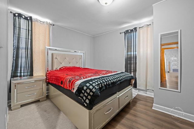 bedroom featuring dark hardwood / wood-style floors