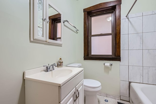 full bathroom featuring tile patterned floors, toilet, vanity, and shower / washtub combination