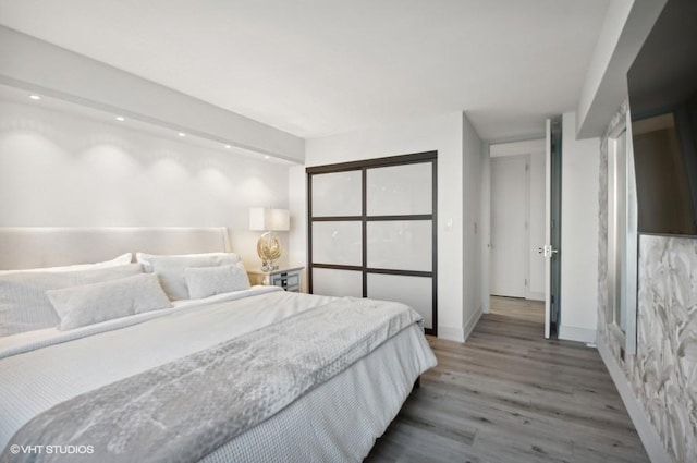 bedroom with wood-type flooring