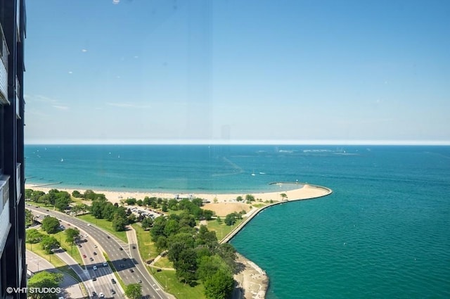 bird's eye view featuring a beach view and a water view