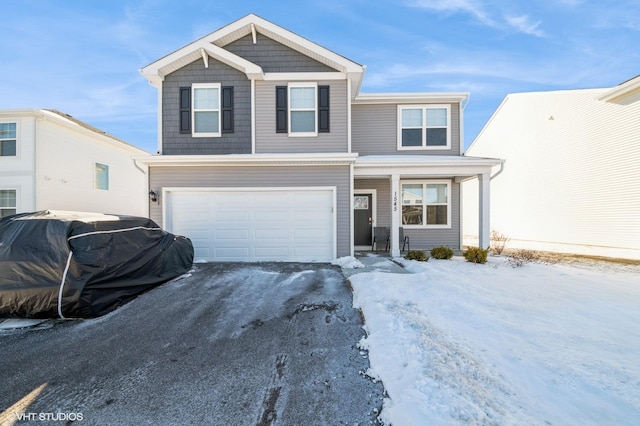 view of front of home with driveway and an attached garage