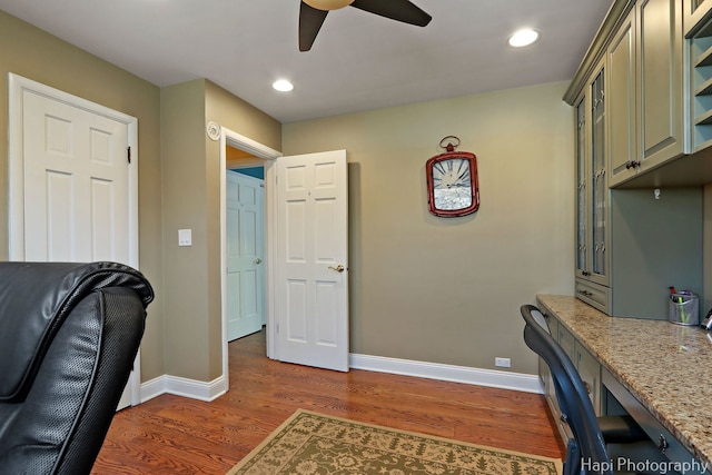 home office with baseboards, wood finished floors, and recessed lighting