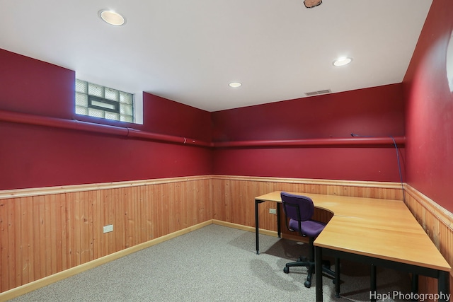 office featuring wooden walls, visible vents, wainscoting, carpet floors, and recessed lighting