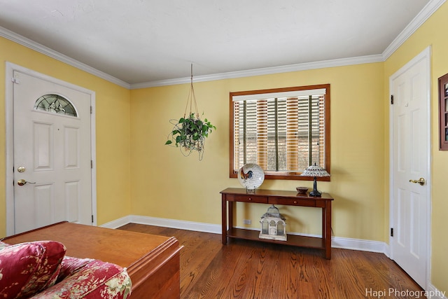 entrance foyer with baseboards, wood finished floors, and ornamental molding