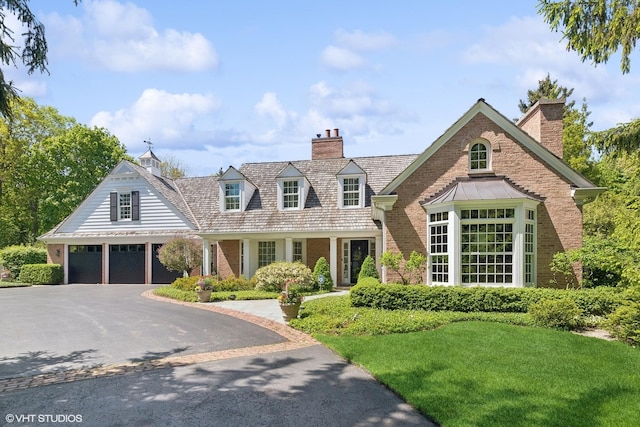 new england style home with a front lawn