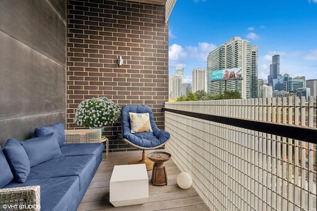 balcony with a view of city and outdoor lounge area