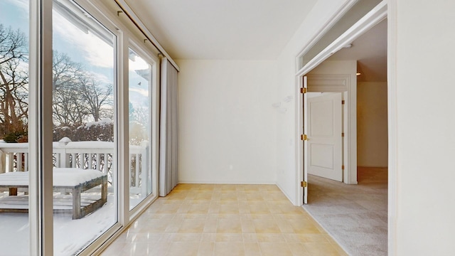 interior space featuring light carpet