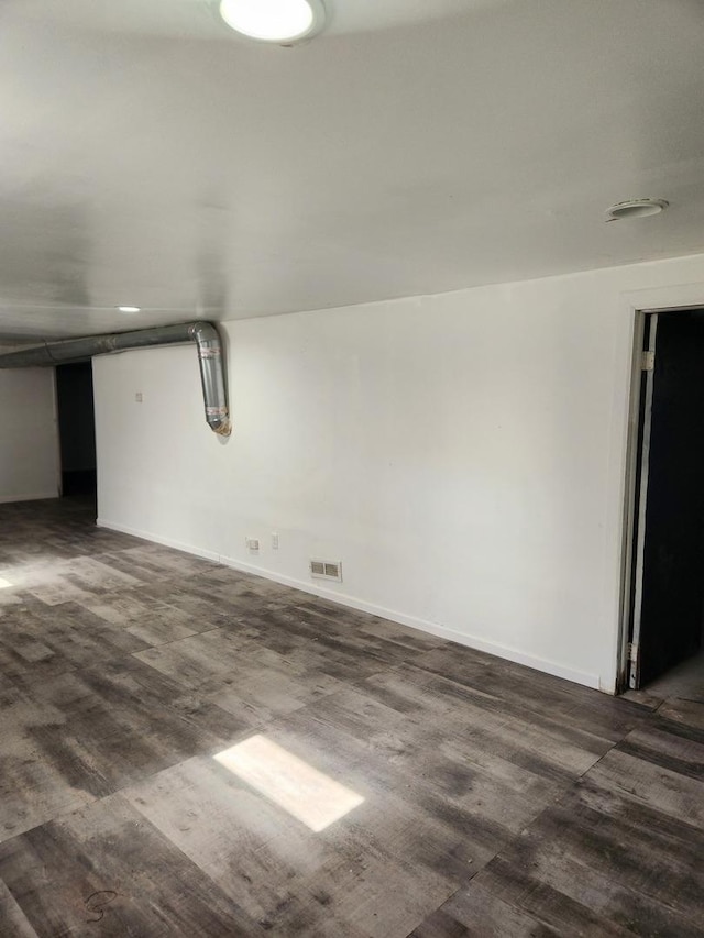 basement featuring dark wood-type flooring