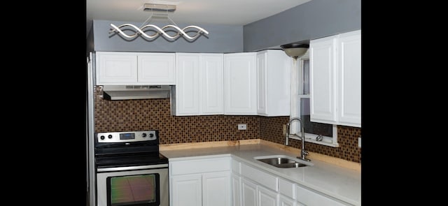 kitchen with stainless steel range with electric cooktop, ventilation hood, backsplash, sink, and white cabinetry